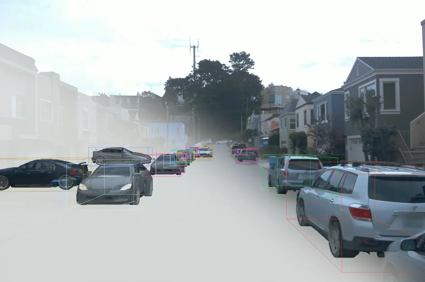 Rendering of 3D models from all tracked cars in a street scene with colorfull bounding boxes overlayed on top of the observed image of that scene.